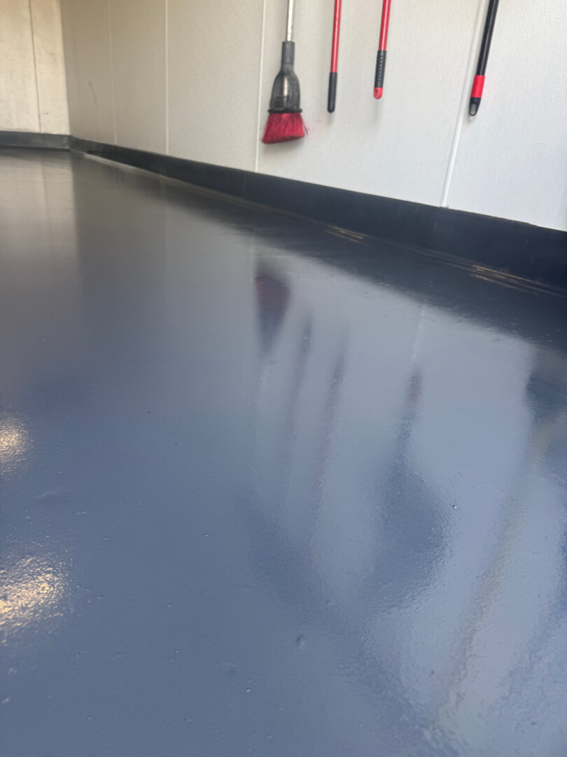 Restaurant pump room with integrated epoxy cove base and seamless floor coating by Legacy Industrial Coatings