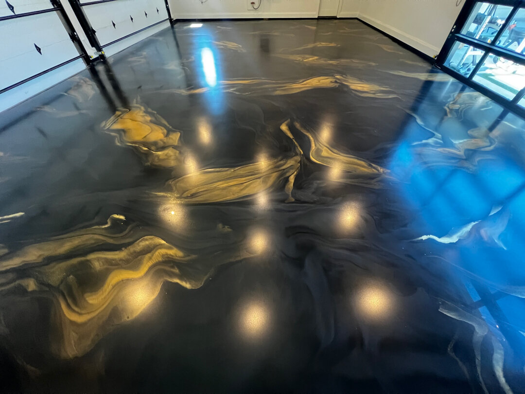 Finished metallic epoxy garage floor in a luxury Argyle, TX home after Legacy Industrial Coatings tear-out and reinstall