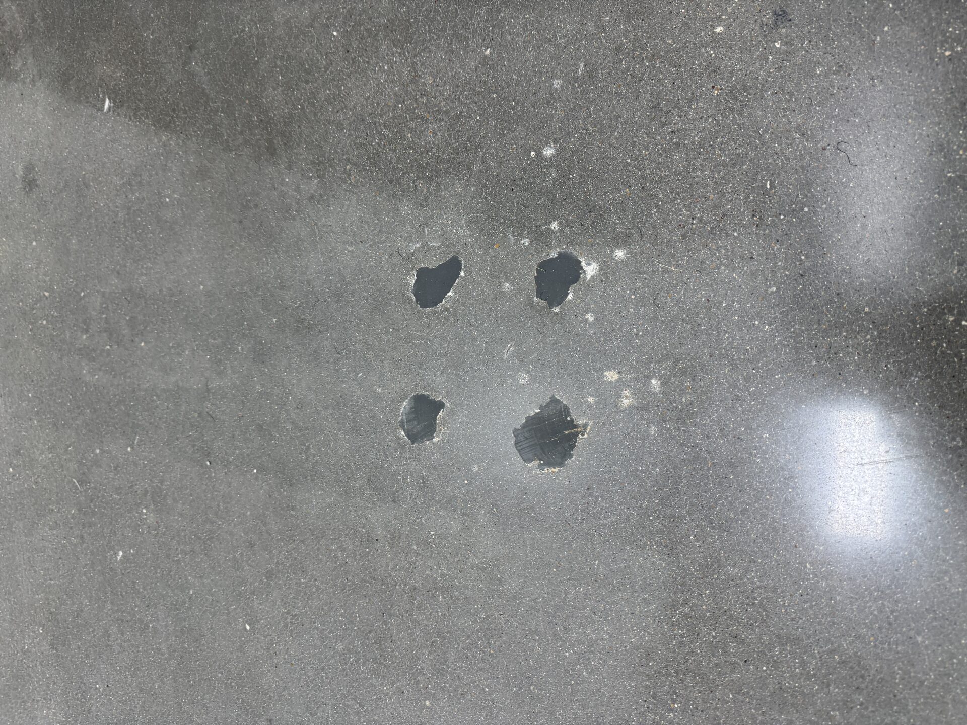 Wide view of finished 800-grit polished concrete in pharmaceutical facility — uniform shine across the entire floor