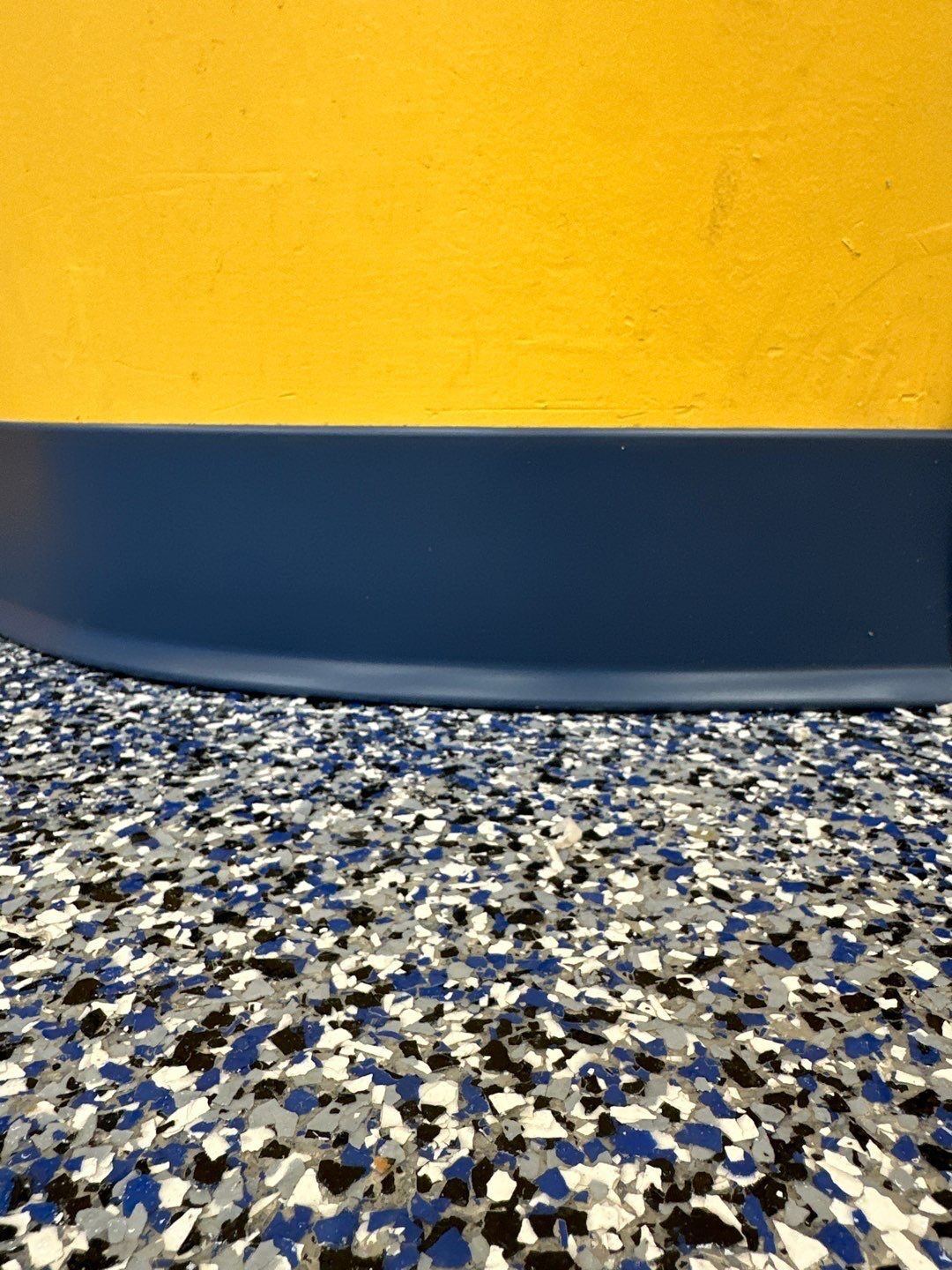 Swim school flake floor close-up — slip-resistant, easy to clean, and engineered for daily wet operation with small children