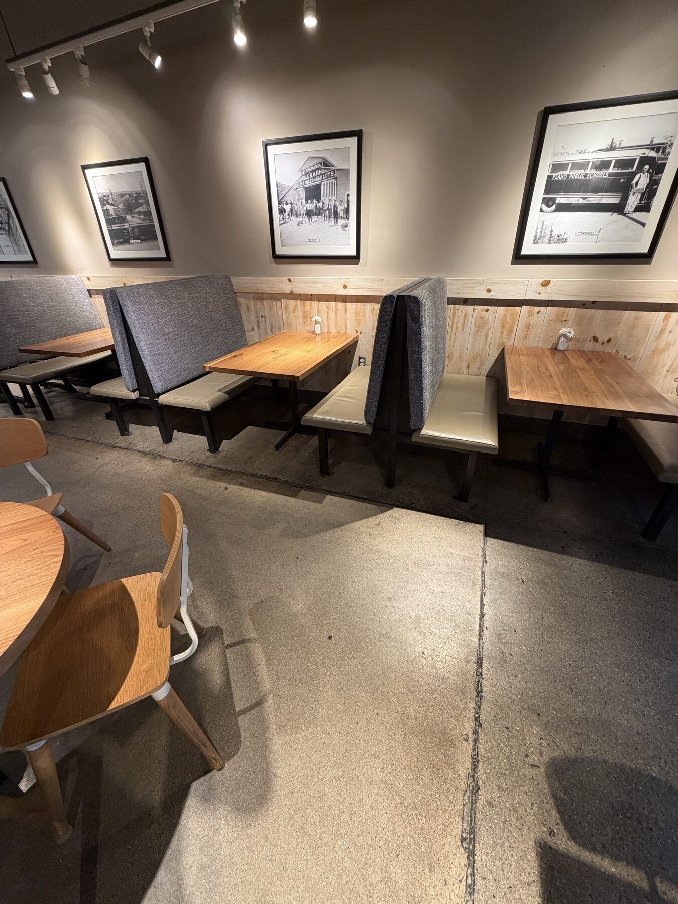 Stained restaurant dining room concrete showing absorbed spills before sealing