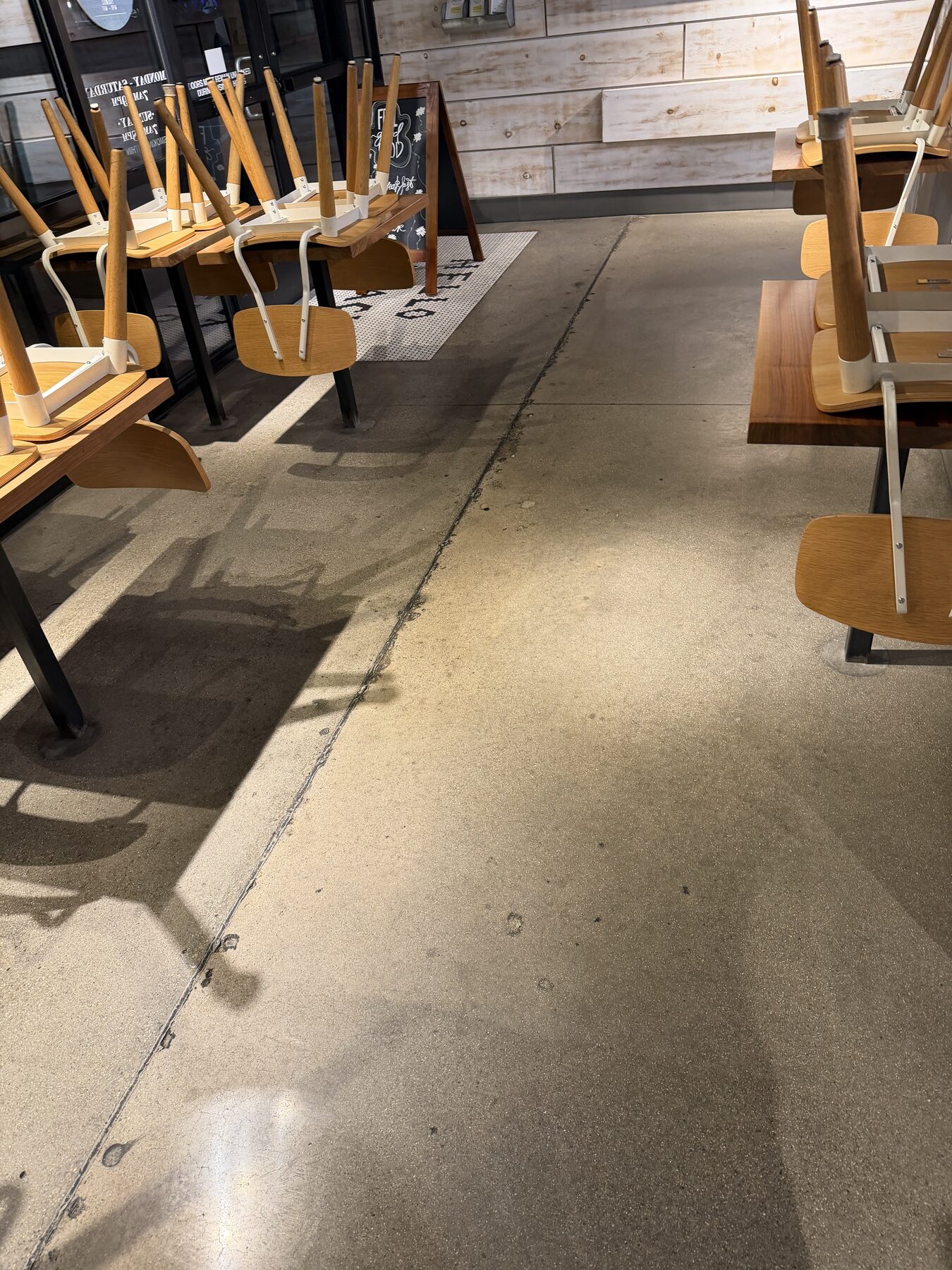 Mechanical deep clean of restaurant concrete floor in progress
