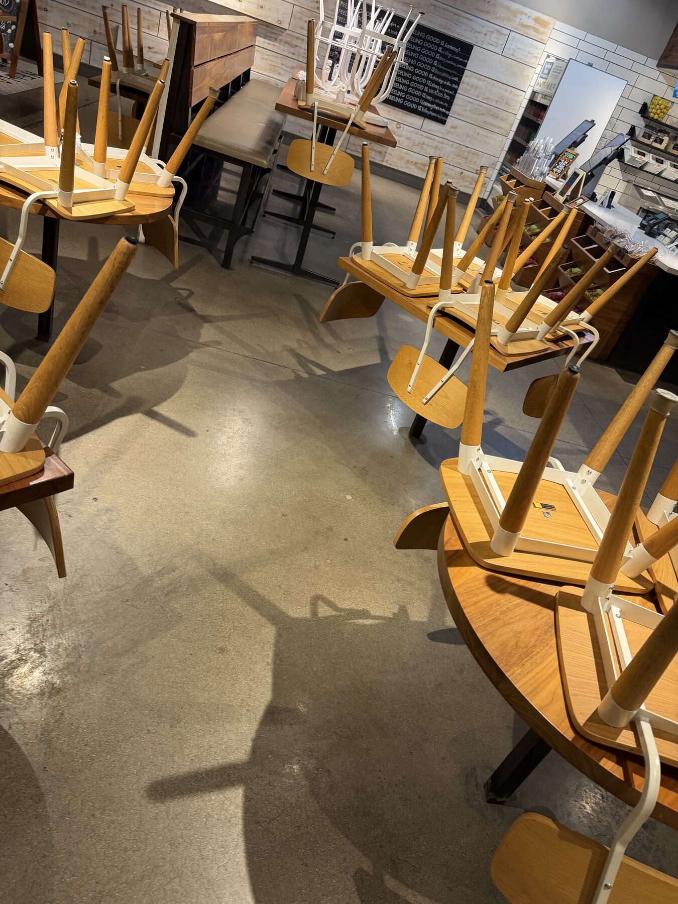 Concrete floor mid-cleaning showing brightening as embedded grime is extracted