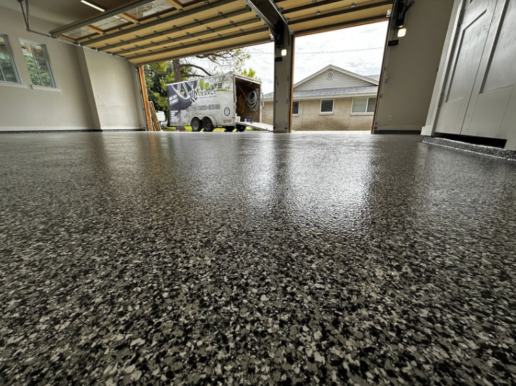 Garage with beautiful speckled epoxy floor coating