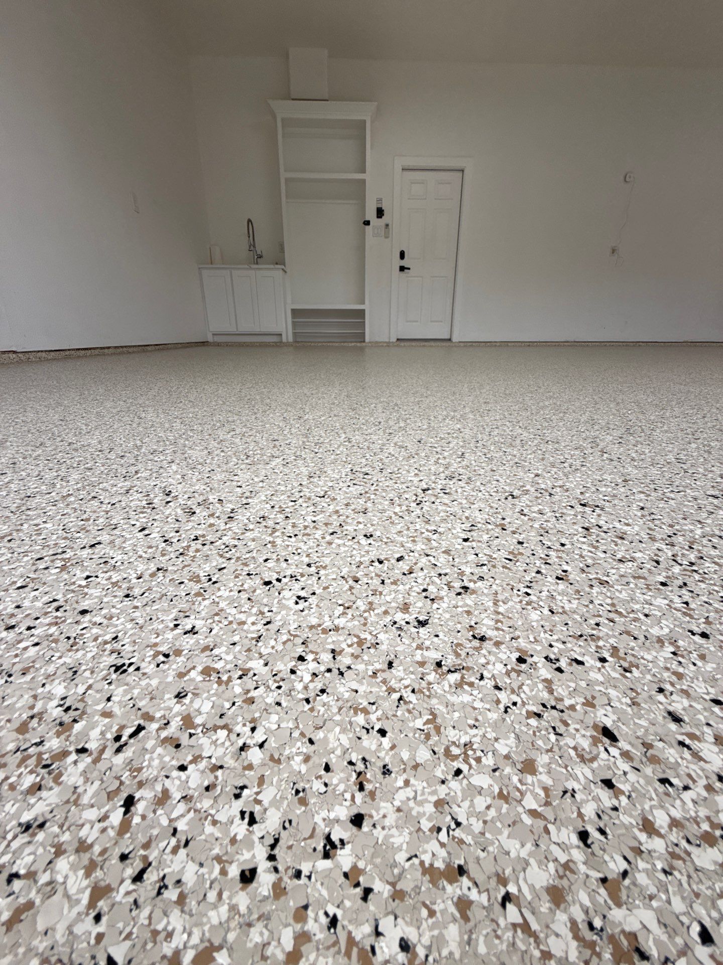After: Beautiful residential garage floor with polyurea flake coating