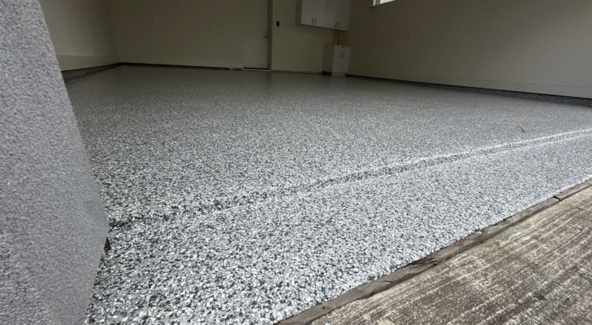 Garage floor with durable speckled coating